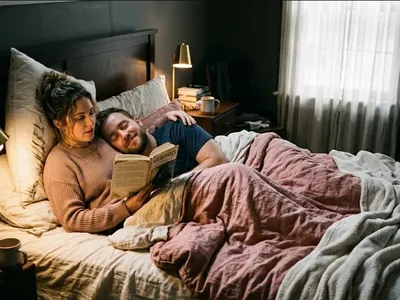 A couple on a bed, one reading aloud to the other, soft lamp light, representing the themes of "Walking on Eggshells: A Partner's Guide to Understanding and Navigating Mom Rage".